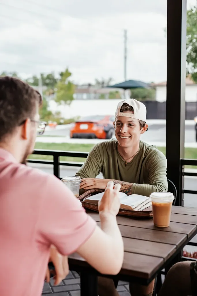 Two people studying the Bible together at a Small Group
