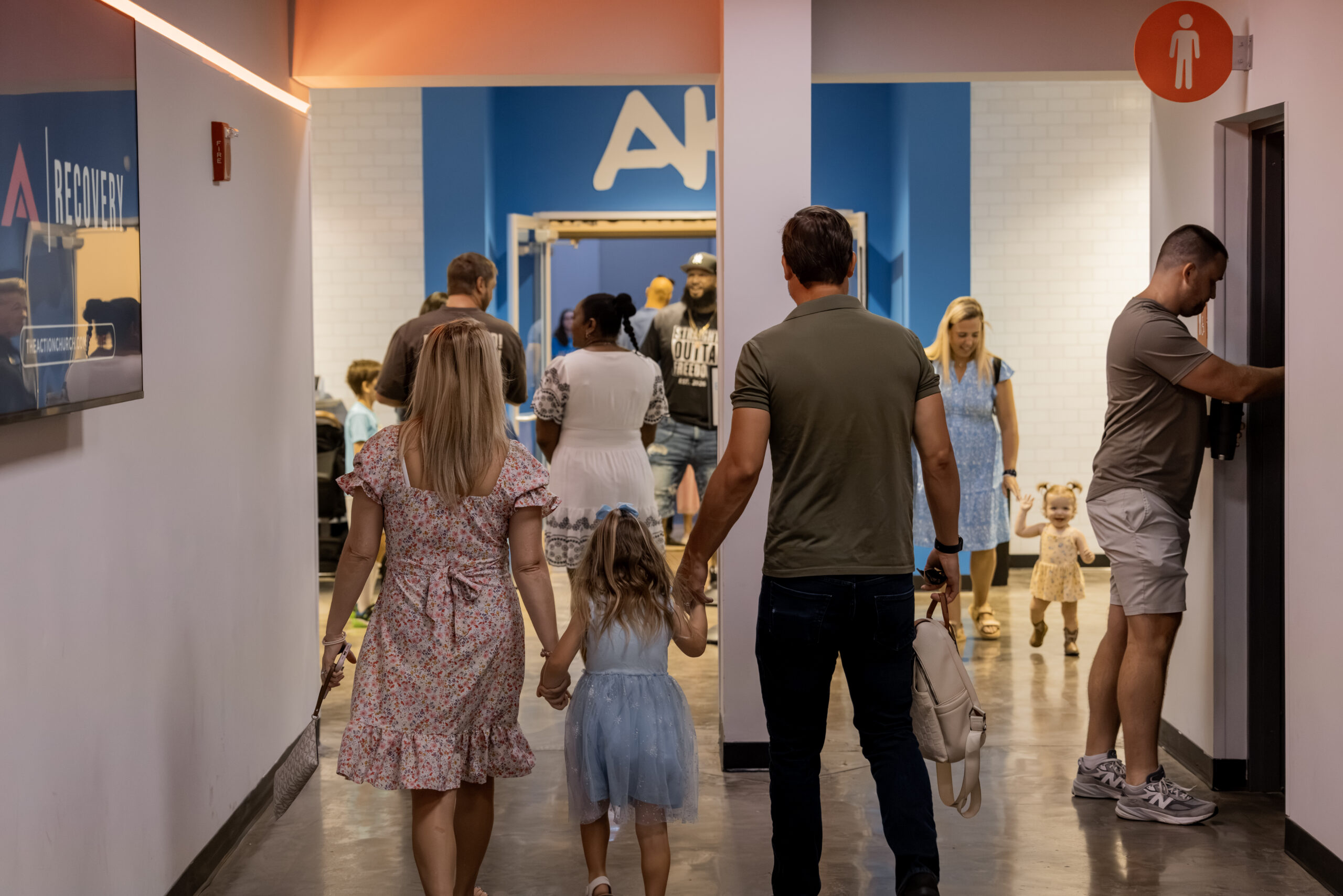 Family arriving for a weekend service at Action Church